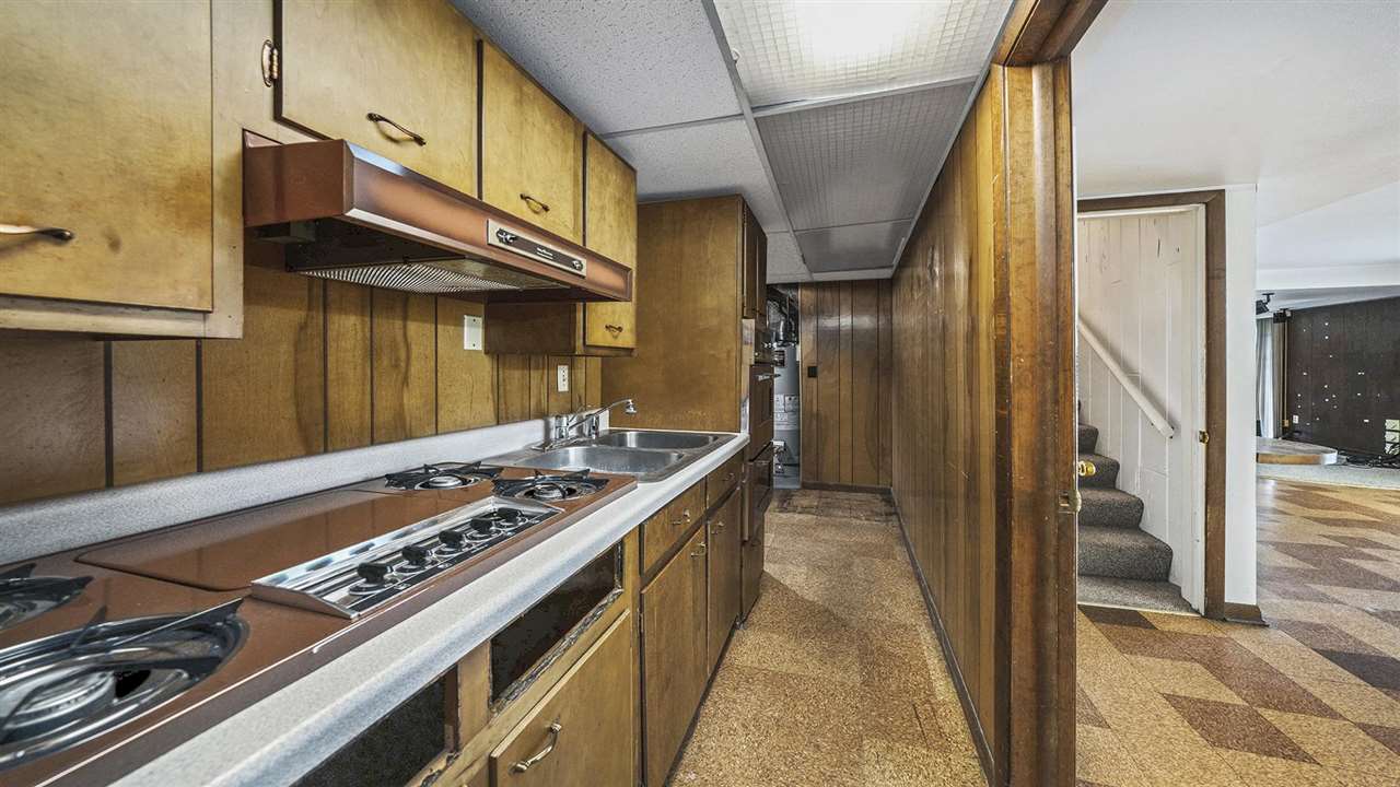 4114 Landstrom Road Rockford, IL 61114 - Photo 28 of 38 a kitchen with stainless steel appliances granite countertop a stove and a refrigerator
