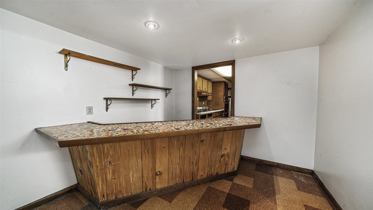 4114 Landstrom Road Rockford, IL 61114 - Photo 29 of 38 a kitchen with stainless steel appliances granite countertop a sink a stove and a refrigerator