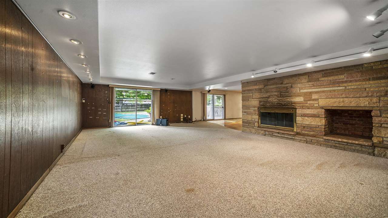 4114 Landstrom Road Rockford, IL 61114 - Photo 31 of 38 a view of an empty room with a fireplace and a window