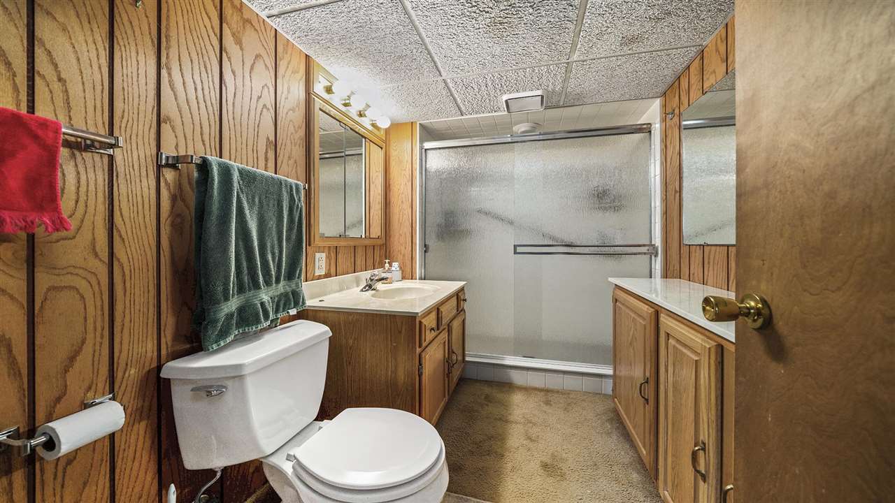 4114 Landstrom Road Rockford, IL 61114 - Photo 32 of 38 a bathroom with a granite countertop sink toilet and shower