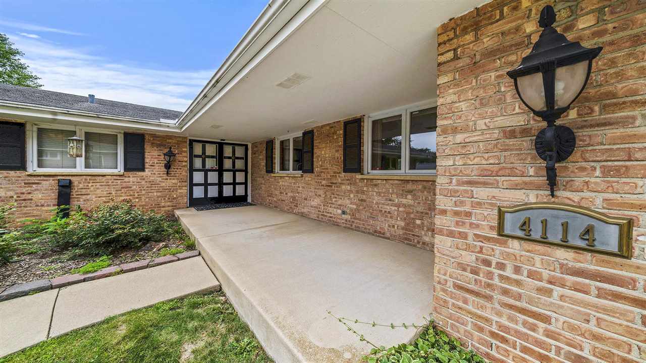 4114 Landstrom Road Rockford, IL 61114 - Photo 4 of 38 a front view of a house with garden