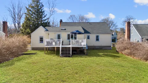 a view of a house with a backyard