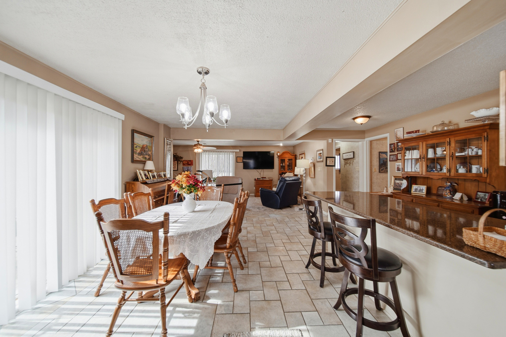 1307 Sinnissippi Road Sterling, IL 61081 - Photo 18 of 33 a view of a dining room with furniture and chandelier