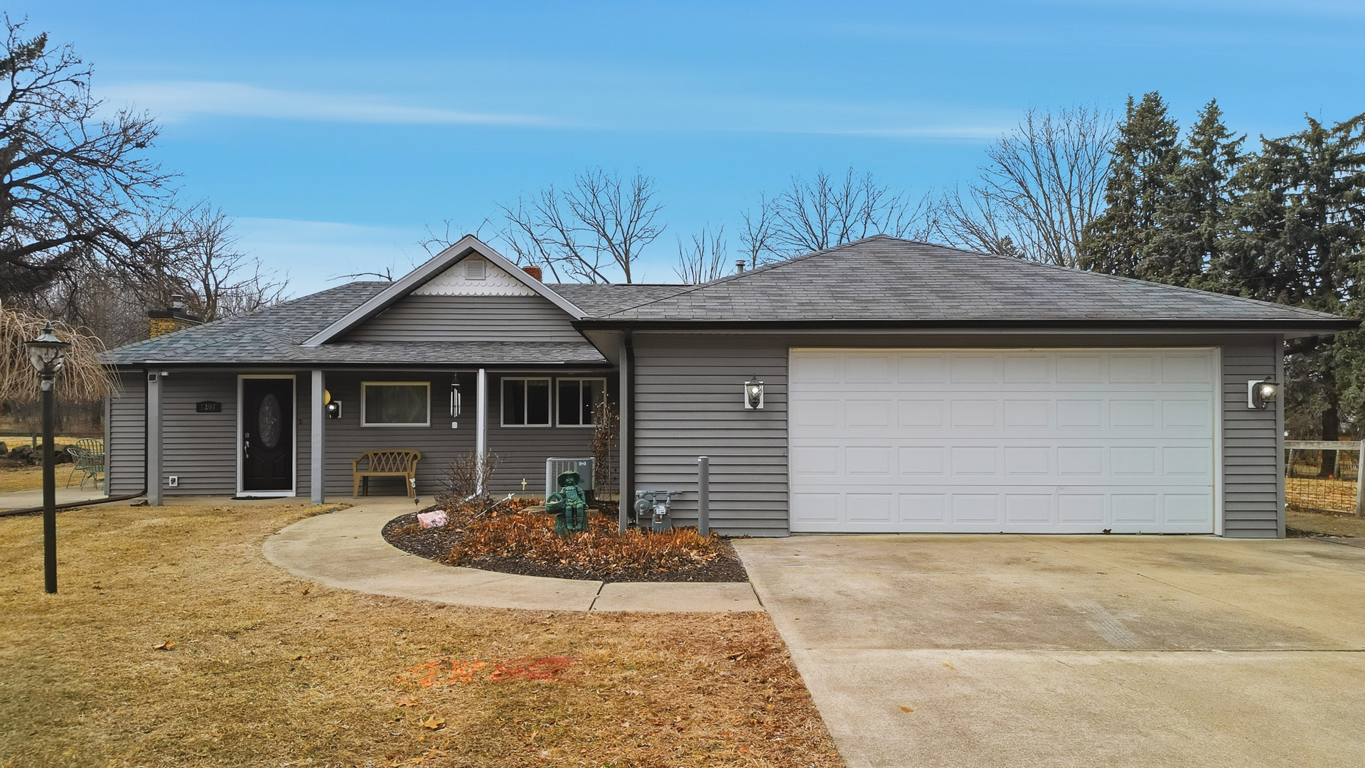 1307 Sinnissippi Road Sterling, IL 61081 - Photo 2 of 33 a front view of a house with a yard