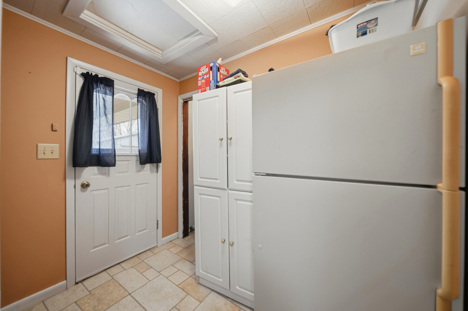 1307 Sinnissippi Road Sterling, IL 61081 - Photo 26 of 33 a view of a refrigerator in kitchen and a window