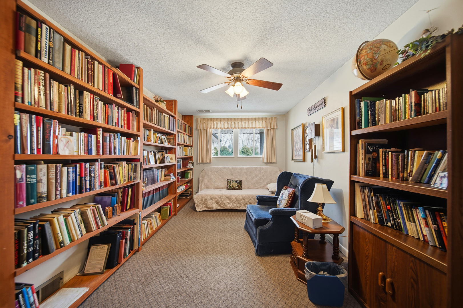 1307 Sinnissippi Road Sterling, IL 61081 - Photo 27 of 33 a living room with large lots of books