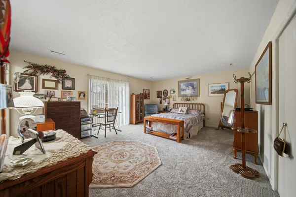 a bed room with a bed and a couch