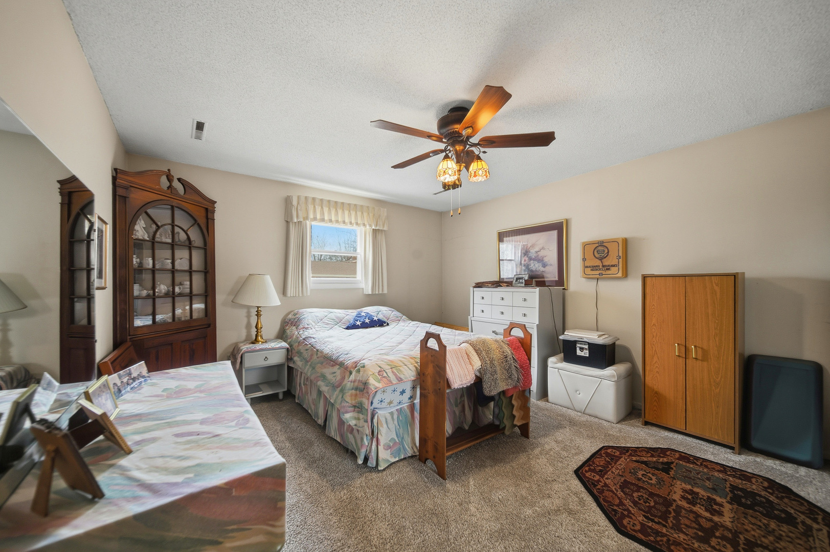 1307 Sinnissippi Road Sterling, IL 61081 - Photo 32 of 33 a bed room with a bed and a couch