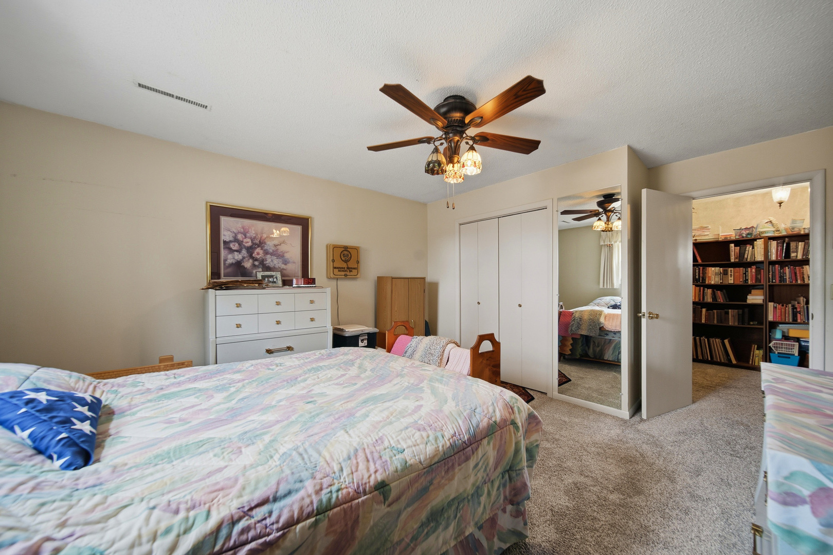 1307 Sinnissippi Road Sterling, IL 61081 - Photo 33 of 33 a bedroom with a large bed and a chandelier