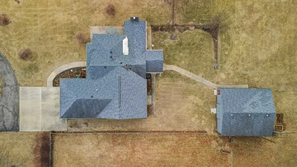 a view of house with outdoor seating