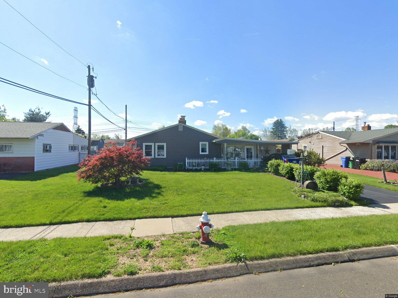 10 Flower Lane Levittown, PA 19055 - Photo 1 of 1 a view of a house with a big yard plants and large tree