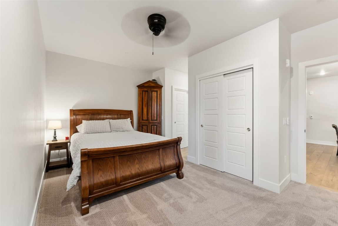 235 La Bonte Street, Unit 106 Dillon, CO 80435 - Photo 12 of 37 a bedroom with a bed and a ceiling fan