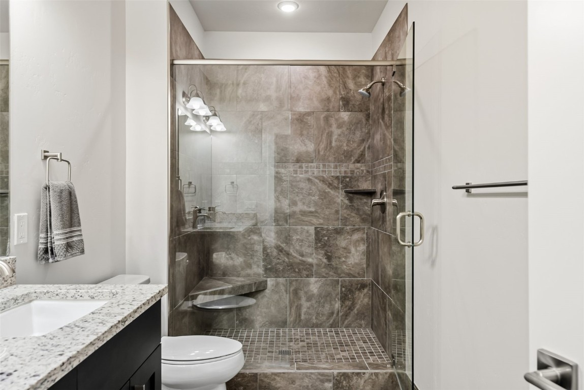 235 La Bonte Street, Unit 106 Dillon, CO 80435 - Photo 29 of 37 a bathroom with a granite countertop sink a toilet and shower