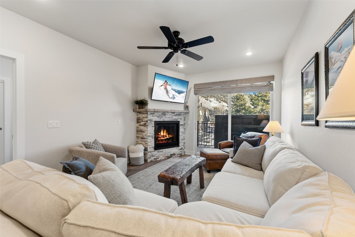 235 La Bonte Street, Unit 106 Dillon, CO 80435 - Photo 6 of 37 a living room with furniture a fireplace and a large window