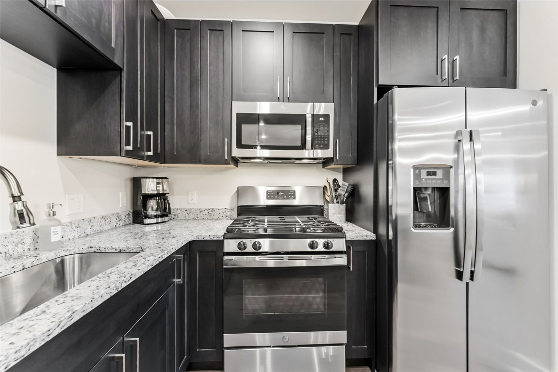 235 La Bonte Street, Unit 106 Dillon, CO 80435 - Photo 7 of 37 a kitchen with a refrigerator stove and sink