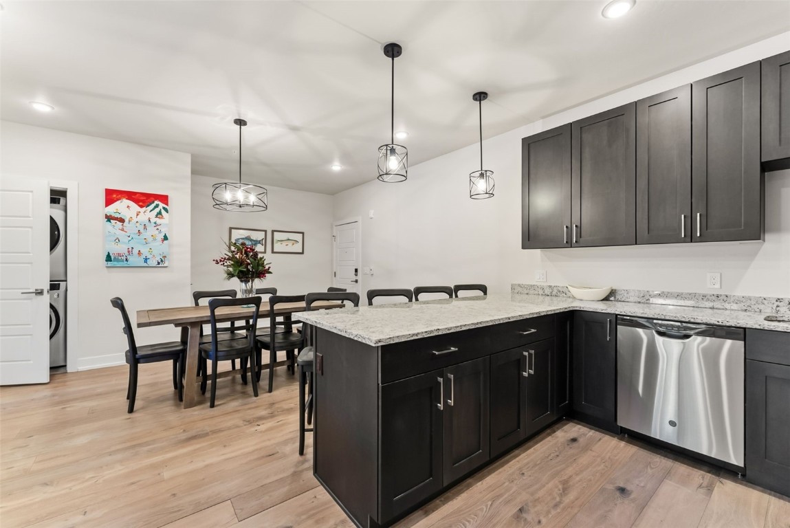 235 La Bonte Street, Unit 106 Dillon, CO 80435 - Photo 8 of 37 a kitchen with kitchen island a sink counter top space and appliances