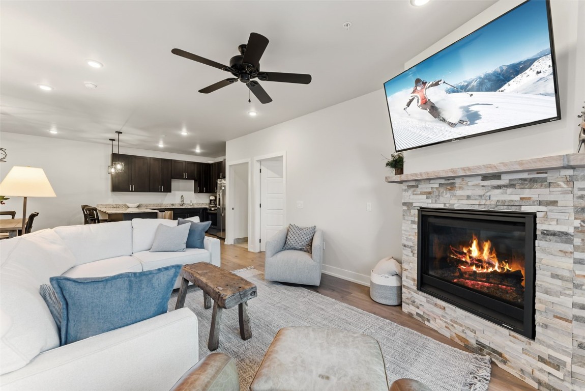 235 La Bonte Street, Unit 106 Dillon, CO 80435 - Photo 9 of 37 a living room with furniture a fireplace and a flat screen tv