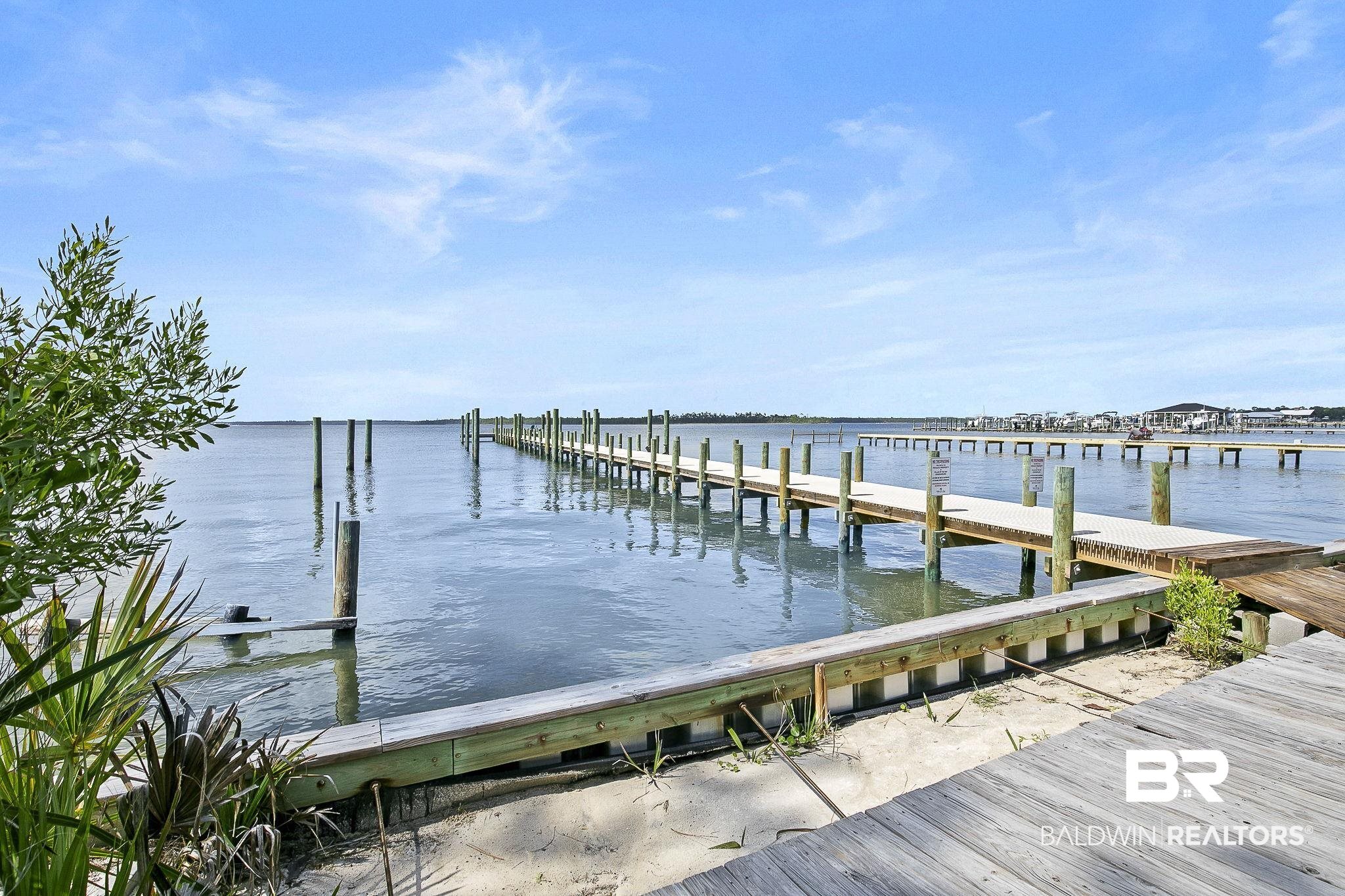 25957 Canal Road, Unit 302 Orange Beach, AL 36561 - Photo 20 of 26 View of dock featuring a water view