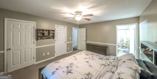 a bedroom with a bed dresser and a window