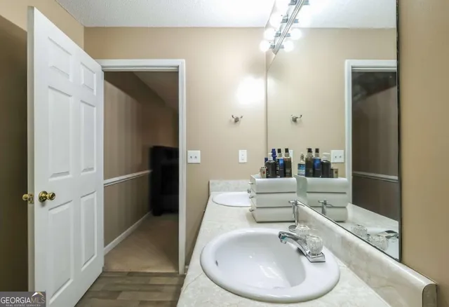 a bathroom with a sink and a mirror