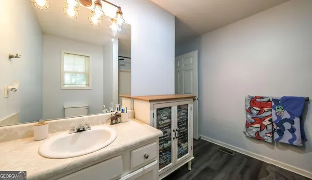 a bathroom with a sink and a mirror