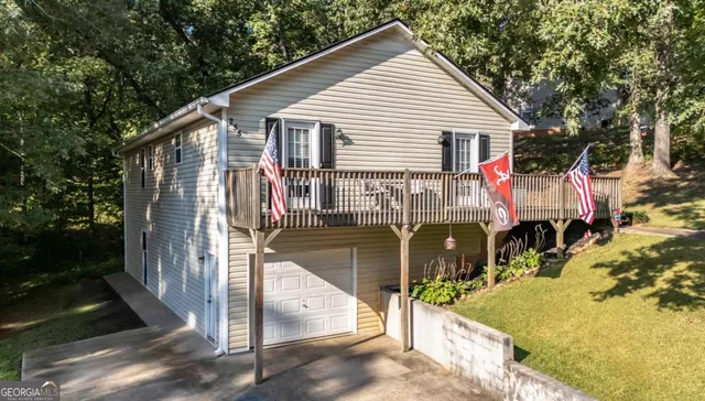 a backyard of a house with lots of green space and a street view