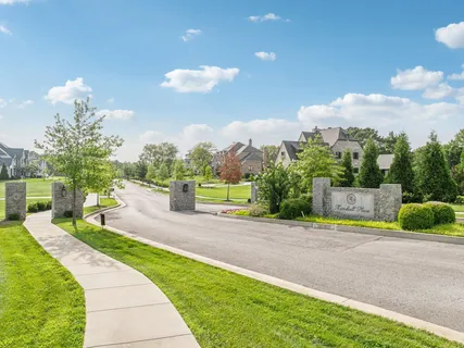 a view of a garden with a building in the background