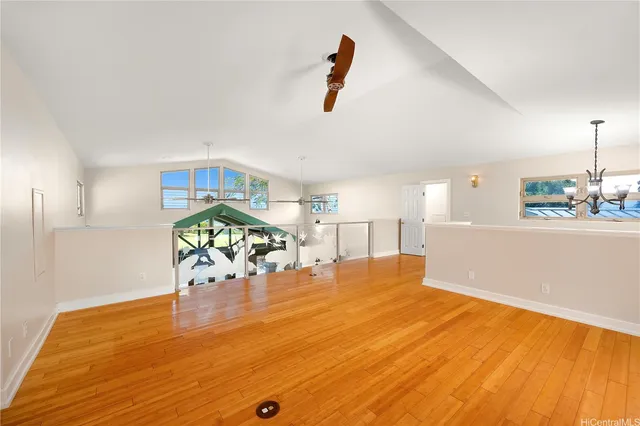 a view of a kitchen with a sink and a window
