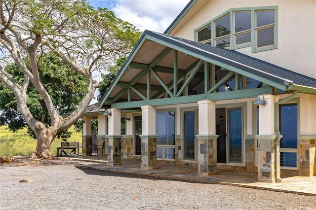 a front view of a house with glass windows