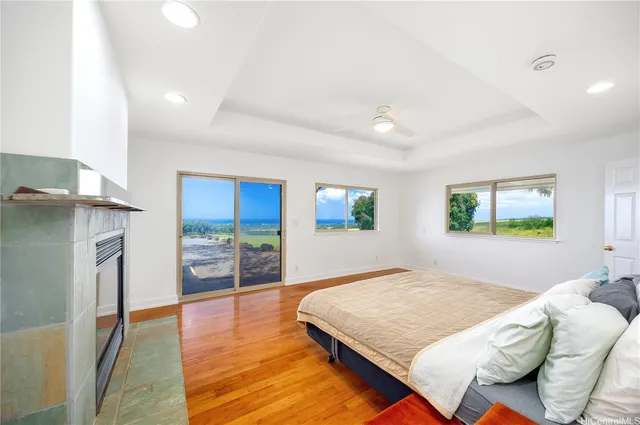 a bedroom with a bed and a view of kitchen