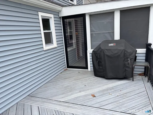 a view of a wooden deck and city view