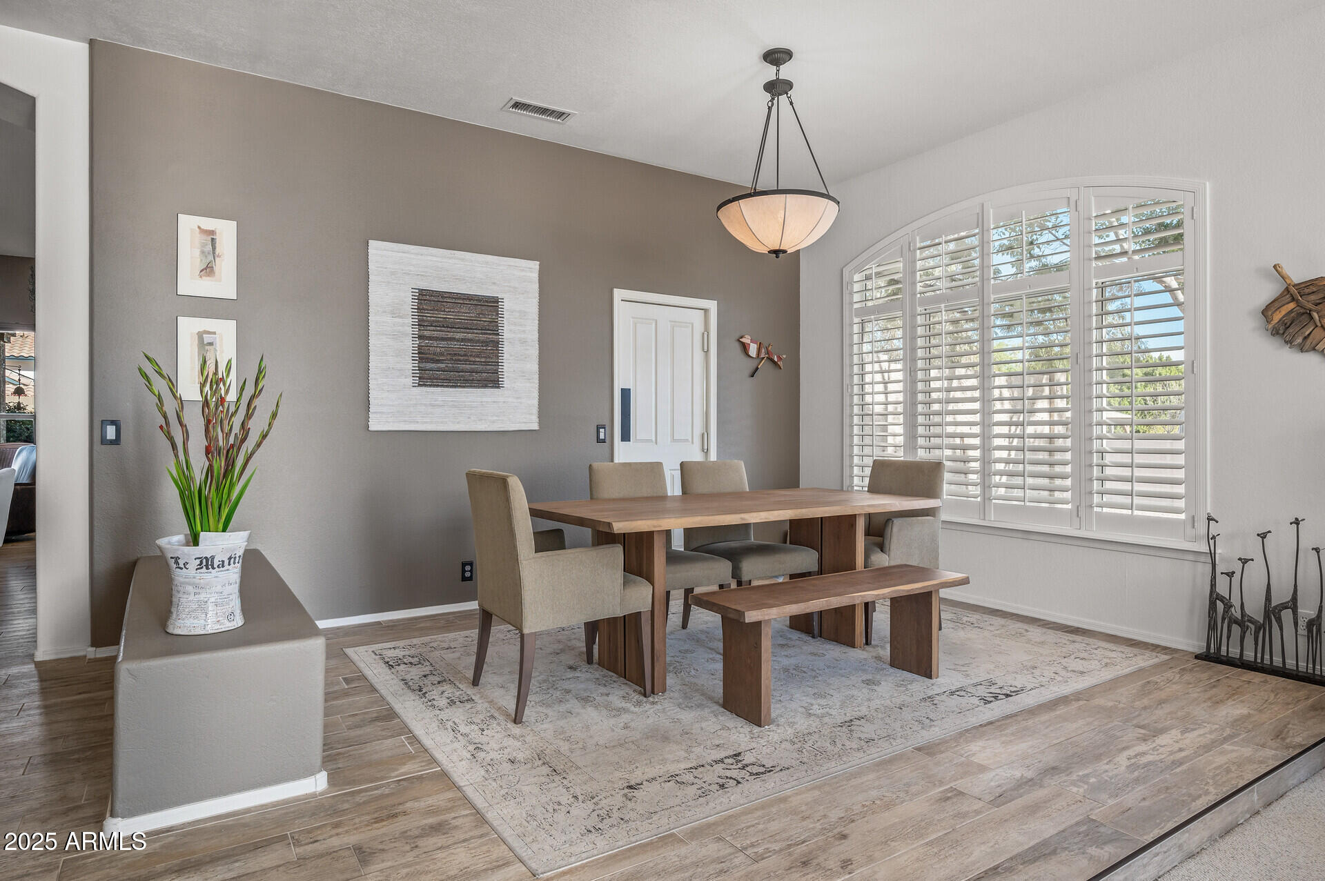 1626 East Kathleen Road Phoenix, AZ 85022 - Photo 12 of 47 a view of a dining room with furniture window and wooden floor