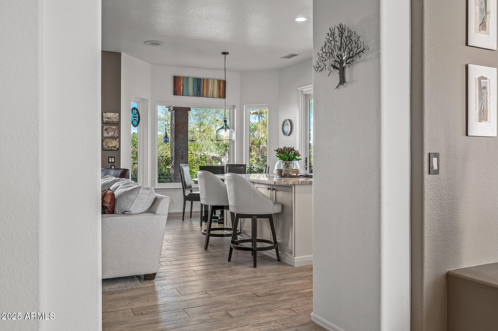 1626 East Kathleen Road Phoenix, AZ 85022 - Photo 14 of 47 a view of a dining room with furniture and wooden floor