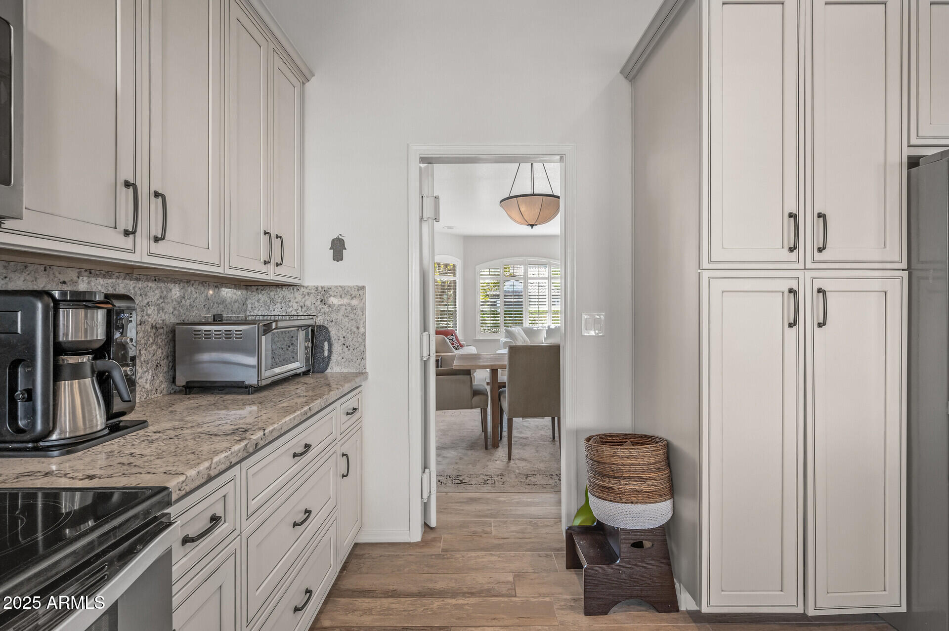 1626 East Kathleen Road Phoenix, AZ 85022 - Photo 23 of 47 a kitchen with granite countertop white cabinets and stainless steel appliances