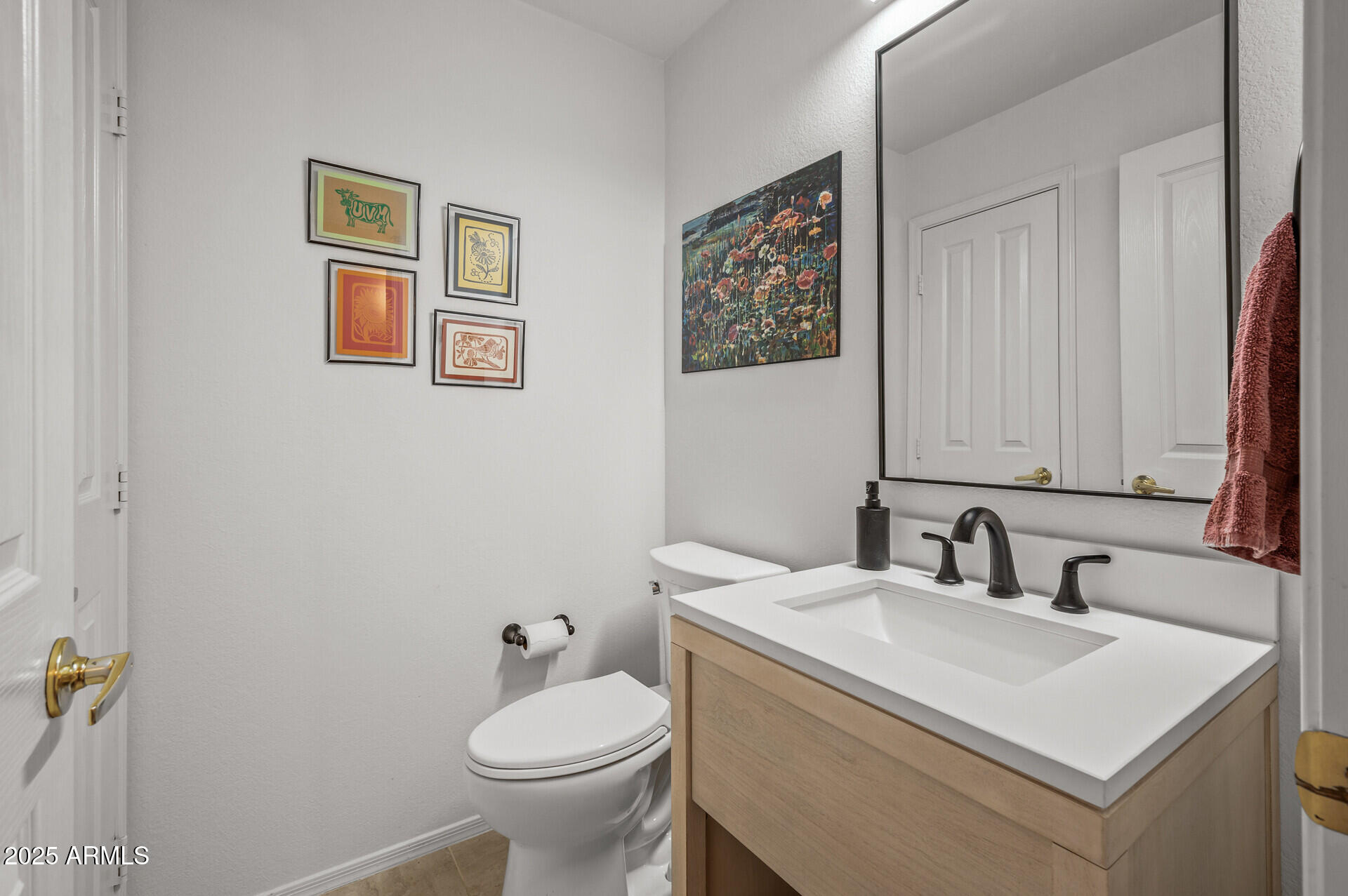 1626 East Kathleen Road Phoenix, AZ 85022 - Photo 25 of 47 a bathroom with a toilet sink and mirror