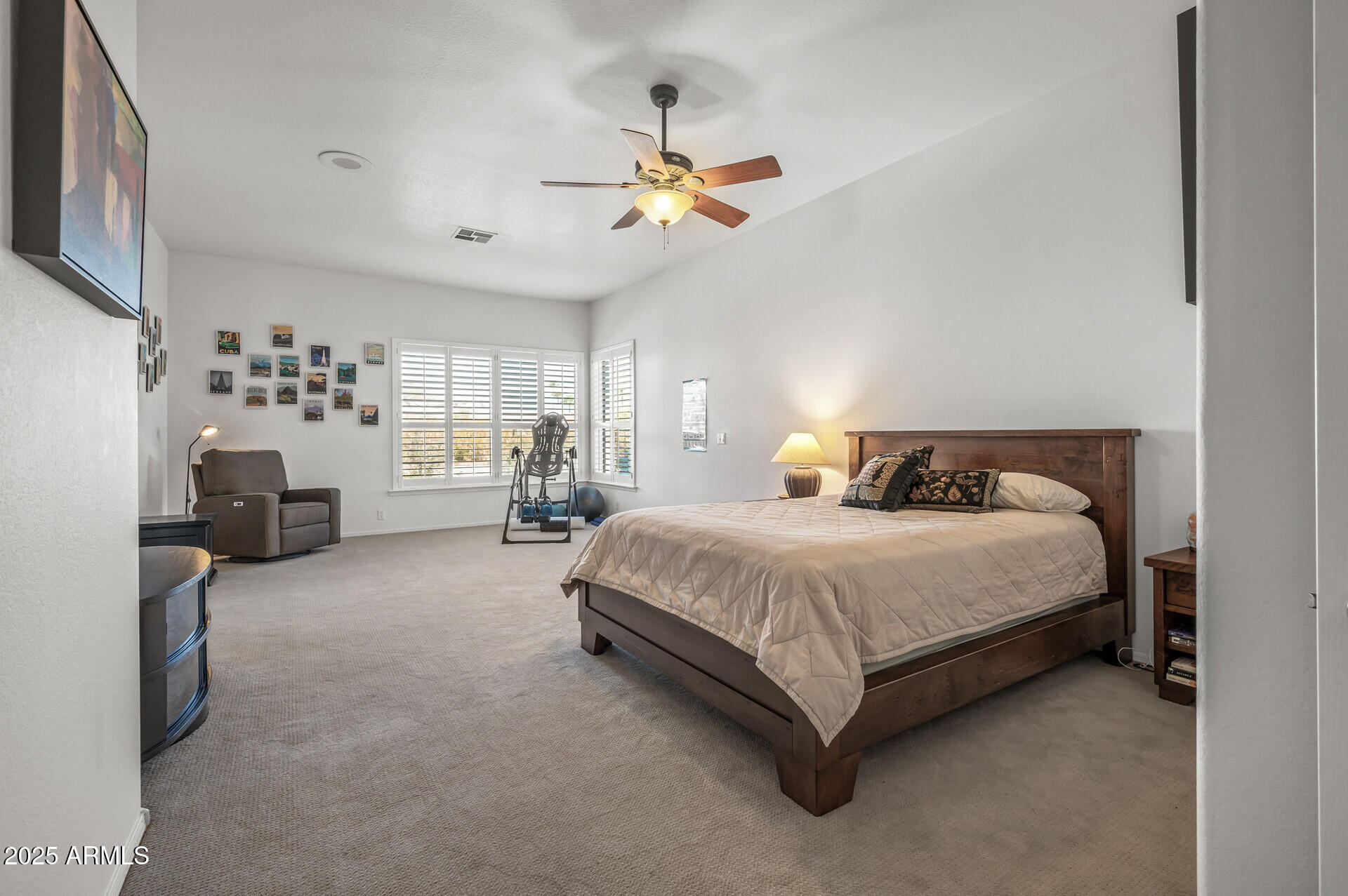 1626 East Kathleen Road Phoenix, AZ 85022 - Photo 31 of 47 a spacious bedroom with a bed and a chandelier