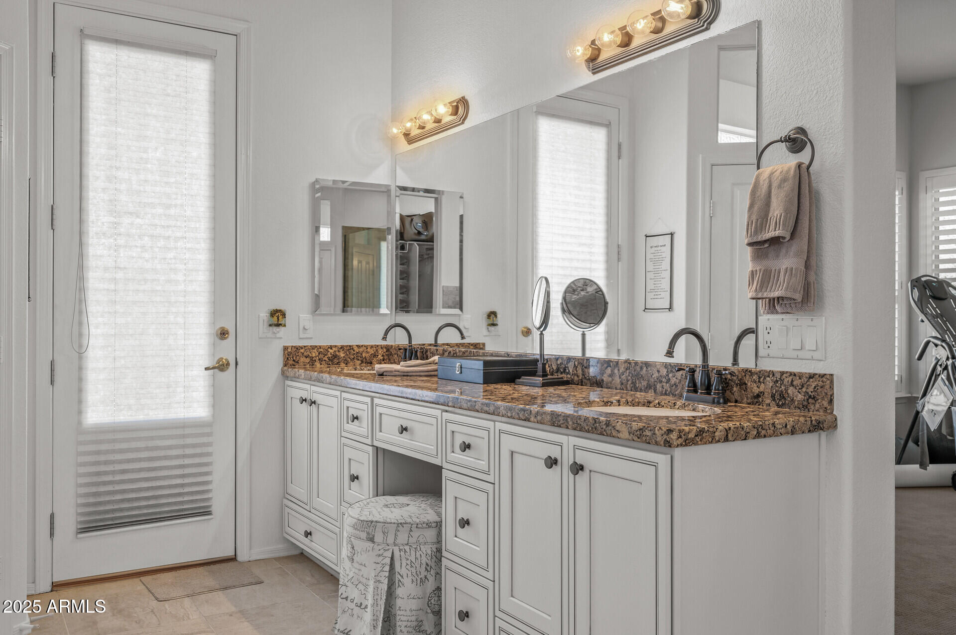 1626 East Kathleen Road Phoenix, AZ 85022 - Photo 33 of 47 a bathroom with double sink and a mirror