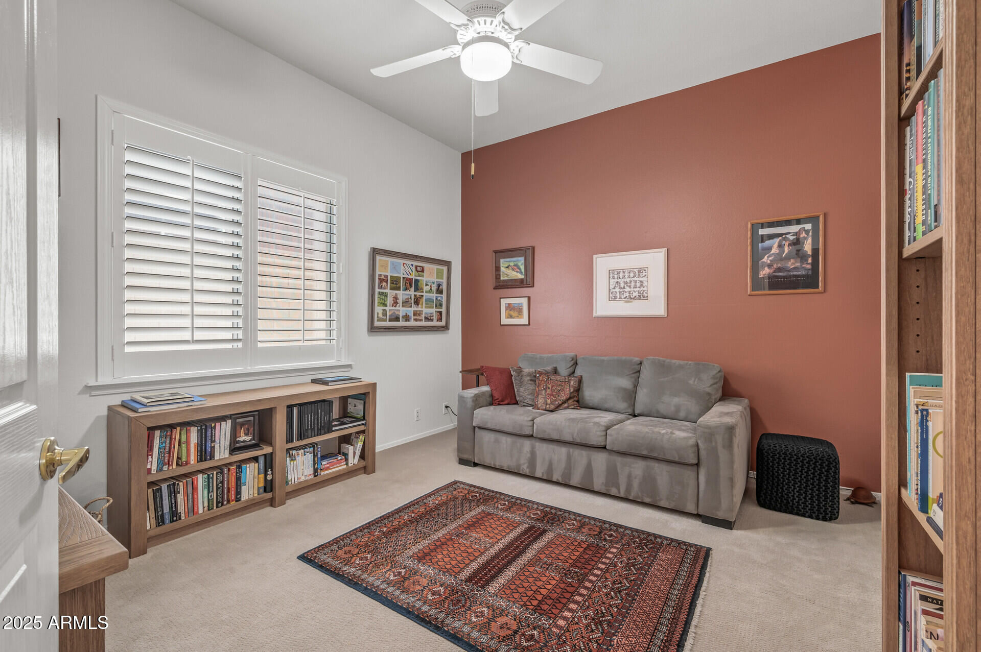 1626 East Kathleen Road Phoenix, AZ 85022 - Photo 35 of 47 a living room with furniture and a book shelf