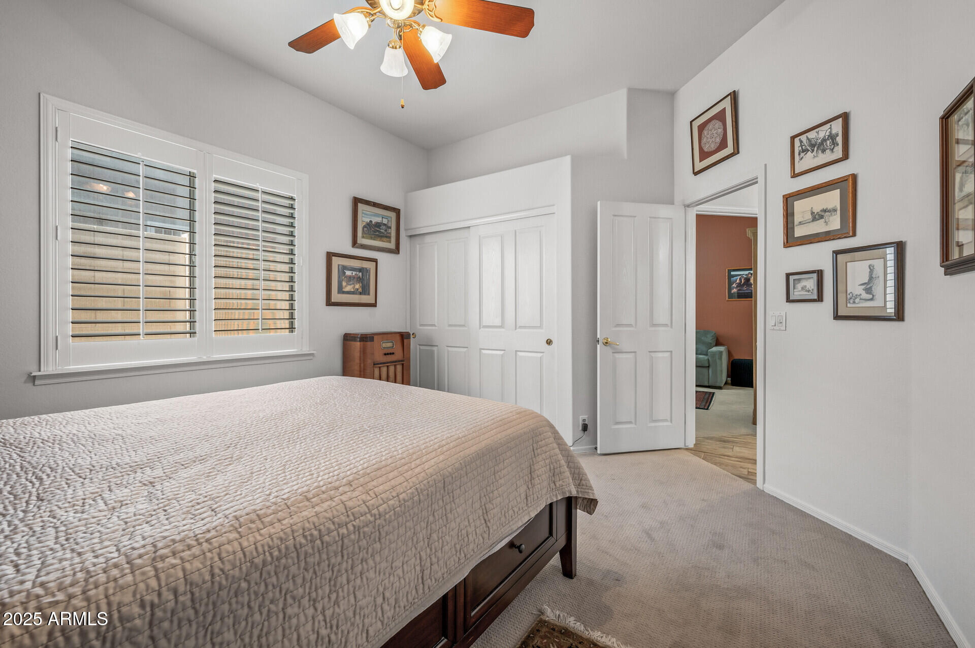 1626 East Kathleen Road Phoenix, AZ 85022 - Photo 38 of 47 a bedroom with a large bed and a chandelier