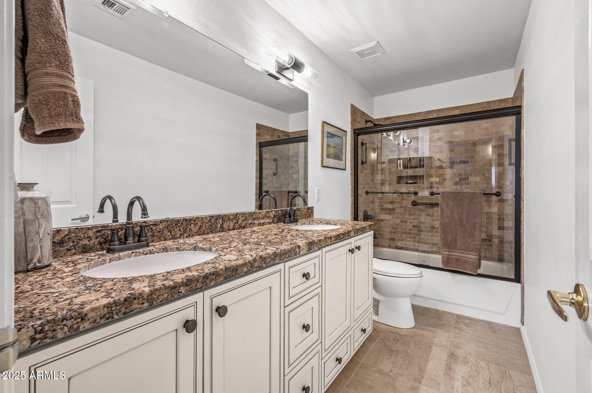 1626 East Kathleen Road Phoenix, AZ 85022 - Photo 39 of 47 a bathroom with a granite countertop sink a toilet a mirror and shower