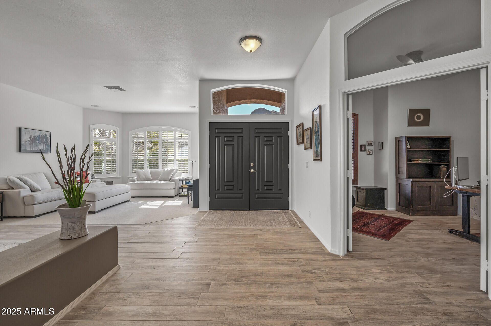 1626 East Kathleen Road Phoenix, AZ 85022 - Photo 6 of 47 a view of livingroom with hardwood floor and a ceiling fan