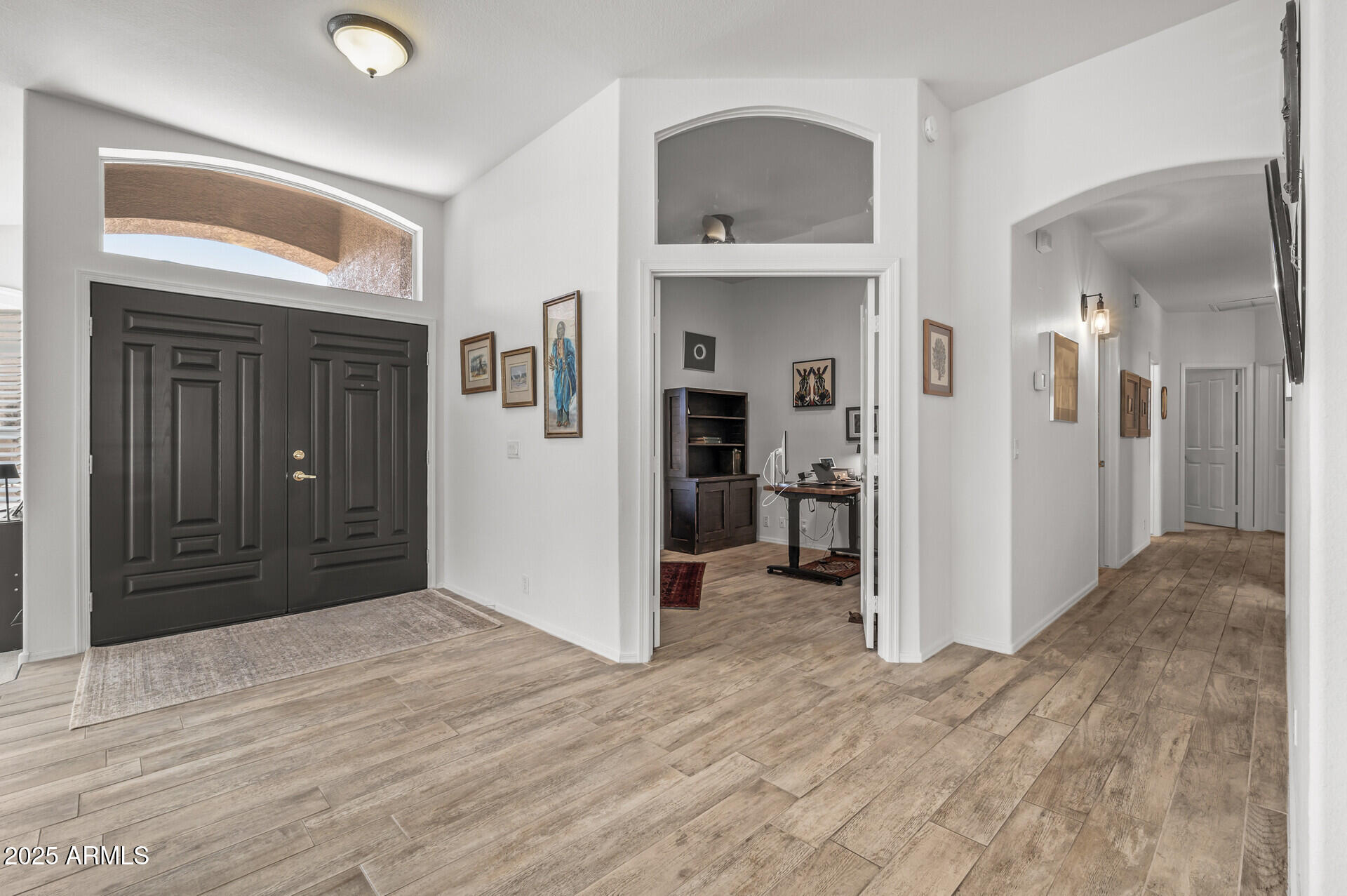 1626 East Kathleen Road Phoenix, AZ 85022 - Photo 7 of 47 a view of a room with wooden floor and a bathroom