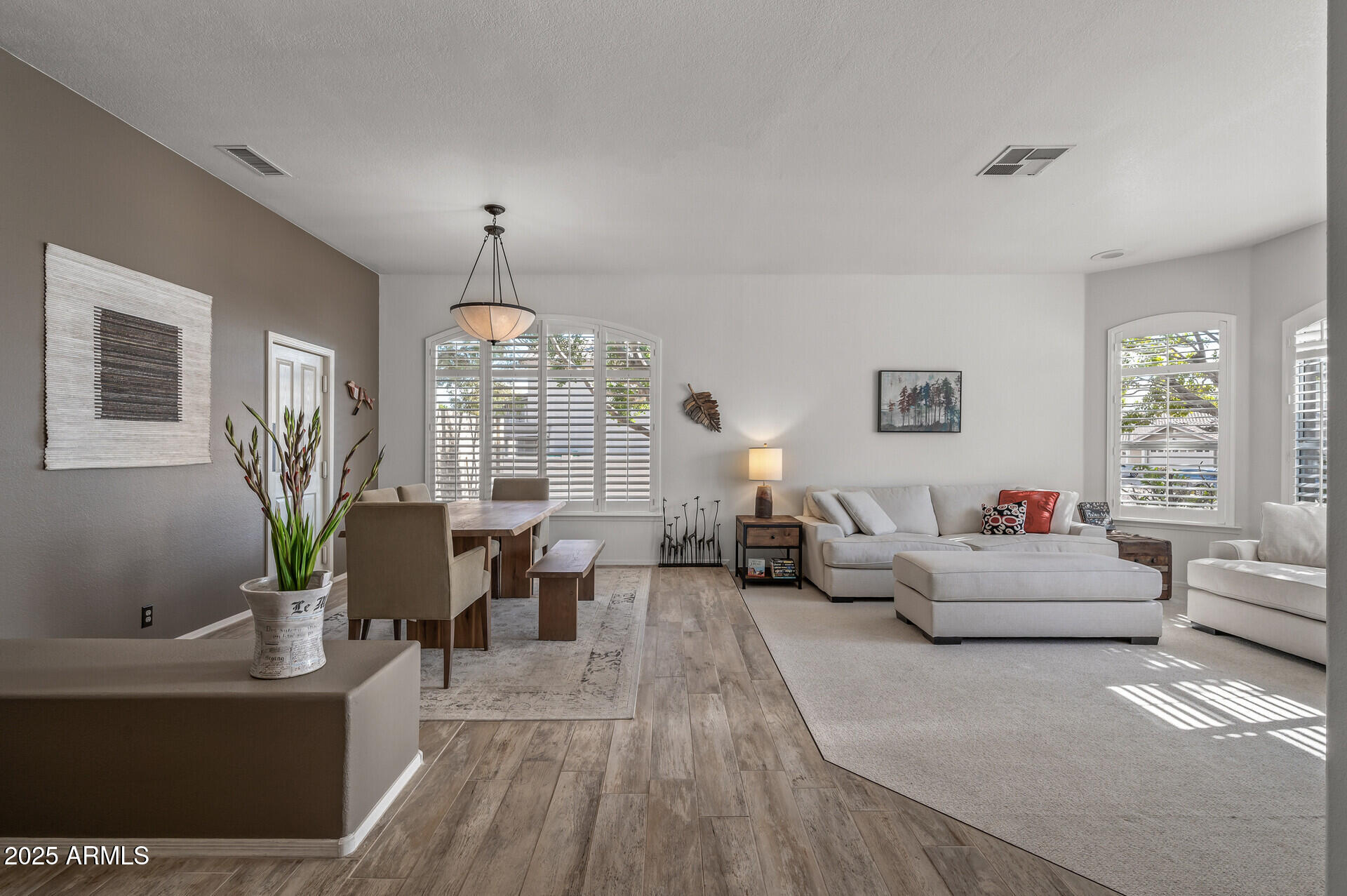 1626 East Kathleen Road Phoenix, AZ 85022 - Photo 10 of 47 a living room with furniture chandelier and a large window