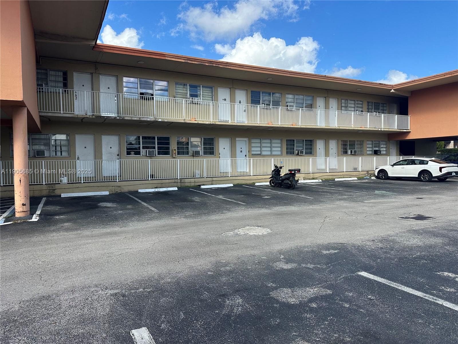 26 Diplomat Parkway, Unit 2314 Hallandale Beach, FL 33009 - Photo 2 of 15 a car parked in front of a building