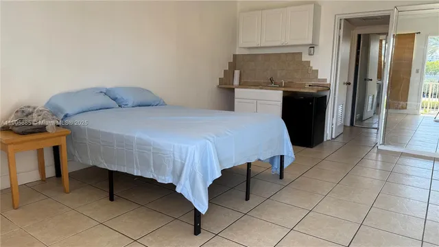 a bedroom with a bed and a table in it