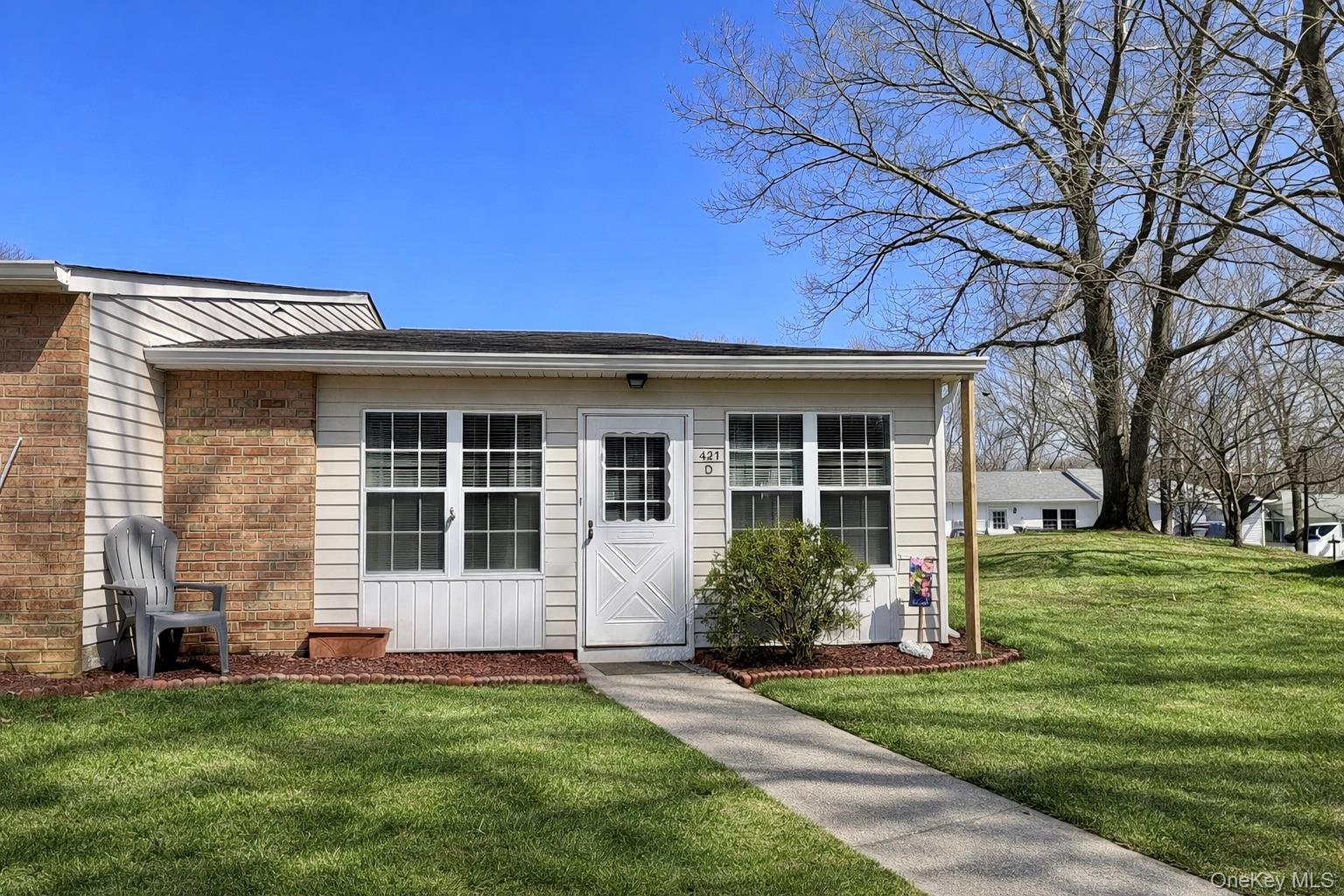 front view of a house with a garden