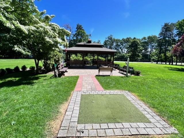421 Weymouth Court, Unit D Ridge, NY 11961 - Photo 21 of 21 a view of backyard with green space
