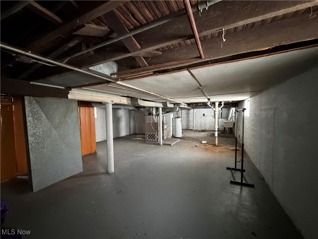 16309 Nela View Road Cleveland, OH 44112 - Photo 24 of 29 Unfinished below grade area featuring heating unit and gas water heater