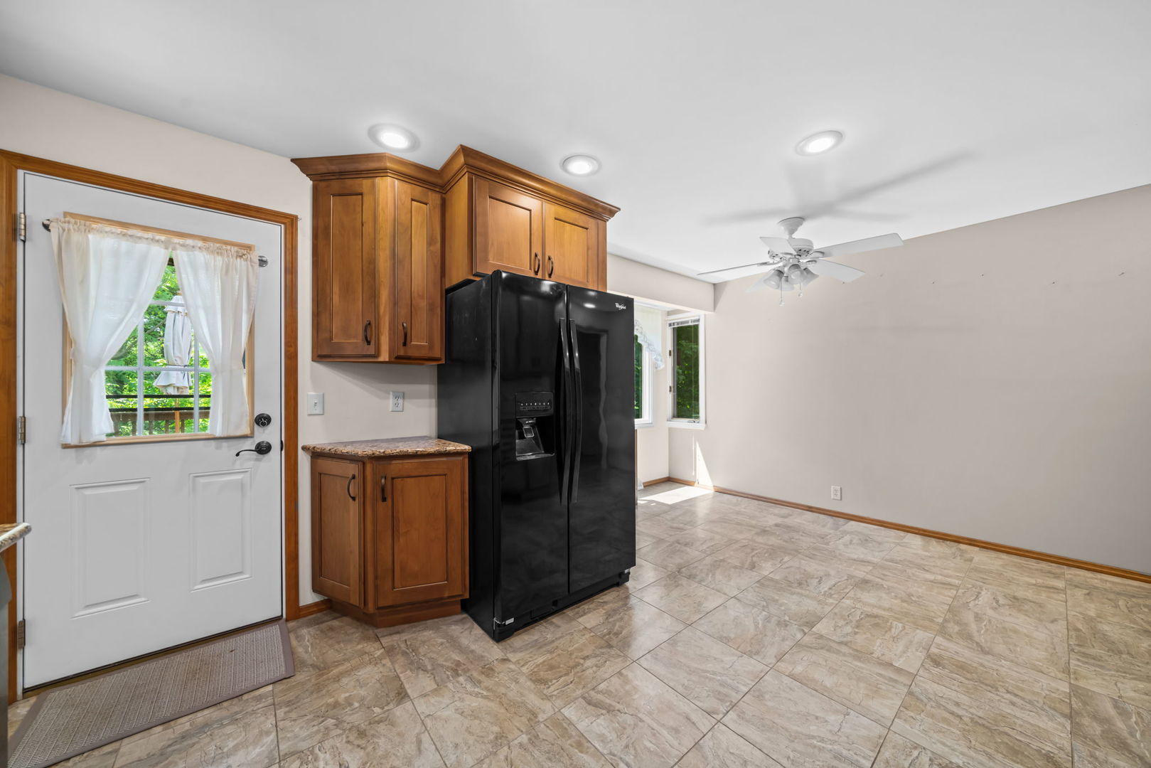 5748 South Skare Road Rochelle, IL 61068 - Photo 6 of 45 a kitchen with stainless steel appliances granite countertop a refrigerator and a sink
