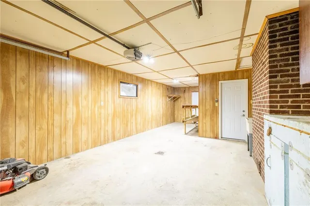 a view of an entryway with wooden floor and windows